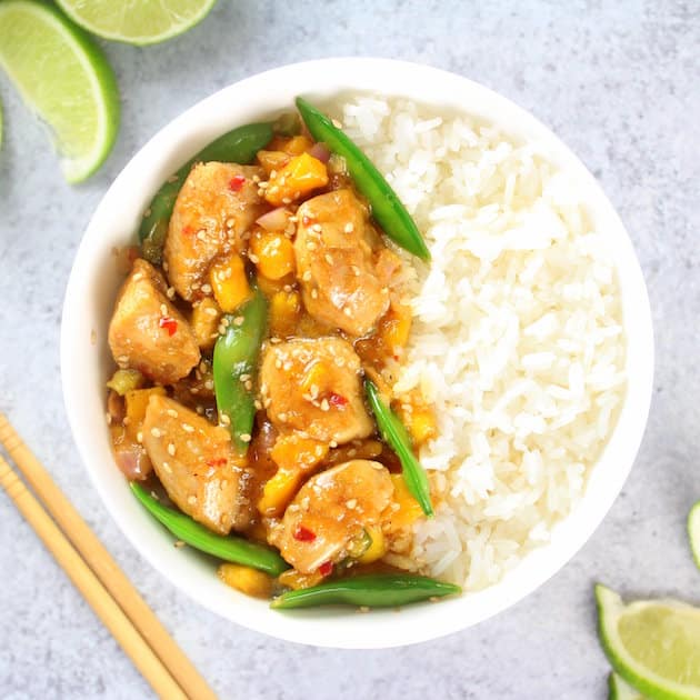 Mango Chicken Stir-Fry in a bowl with white rice