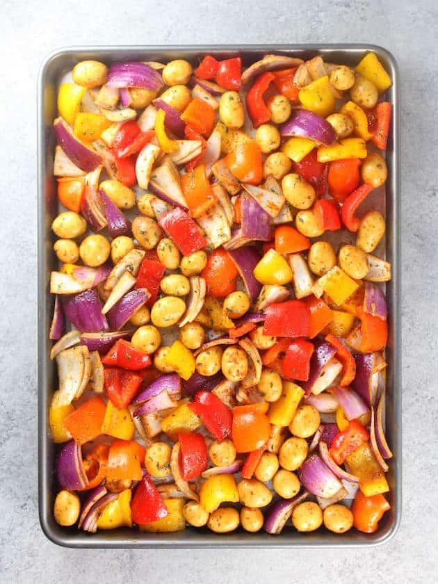 Baking sheet with colorful root vegetables