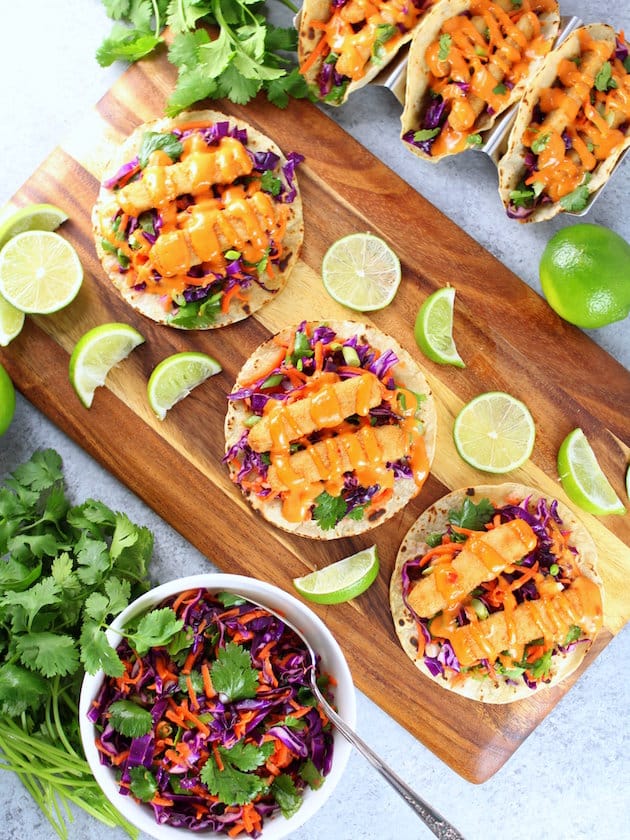 Bang Bang Fish Tacos on corn tortillas, with citrus cabbage slaw, fish sticks