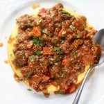 Easy Parmesan Polenta Bolognese Image - Classic Italian dinner with hearty meat sauce 