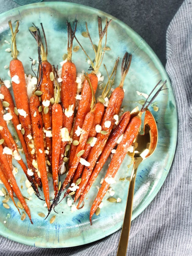 Partial platter of cooked carrots with goat cheese