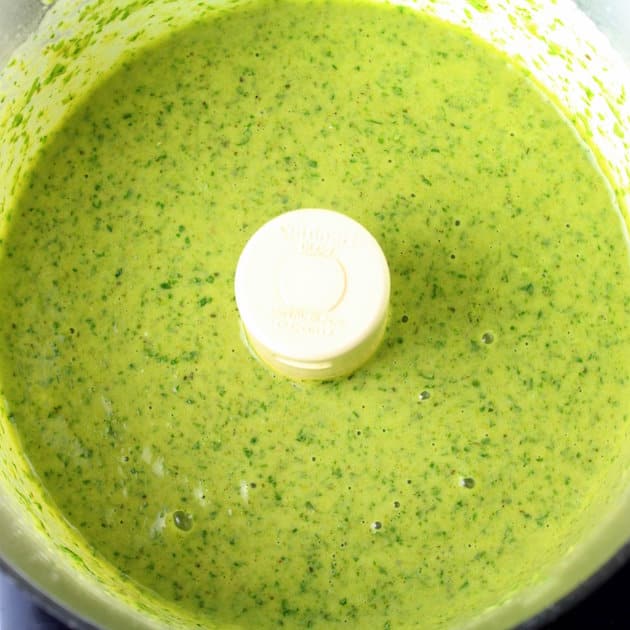 Green Poblano Sauce with chopped cilantro in a food processor 
