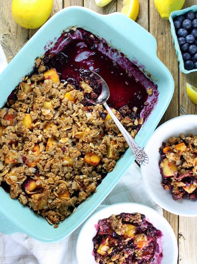 Baking dish and dessert bowls with Tropical Blueberry Mango Coconut Crumble 