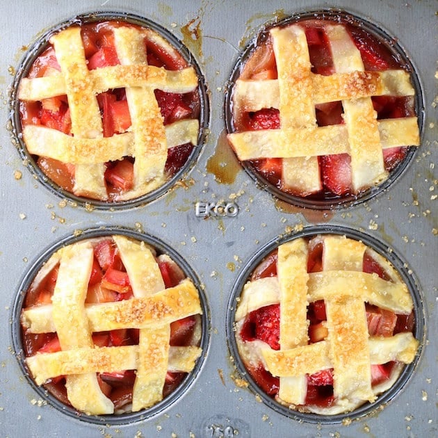 Close up Four Mini Strawberry Rhubarb Pies in Muffin Tin 