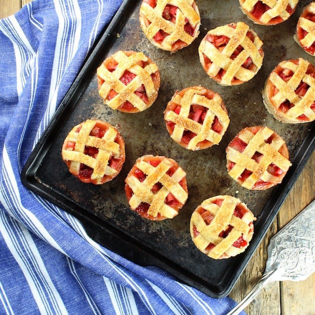 Mini Strawberry Rhubarb Pies on cookie sheet