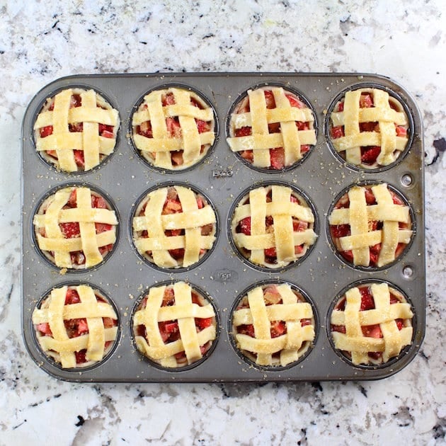 Mini Strawberry Rhubarb Pies in Muffin Tins with latticework pie toppings