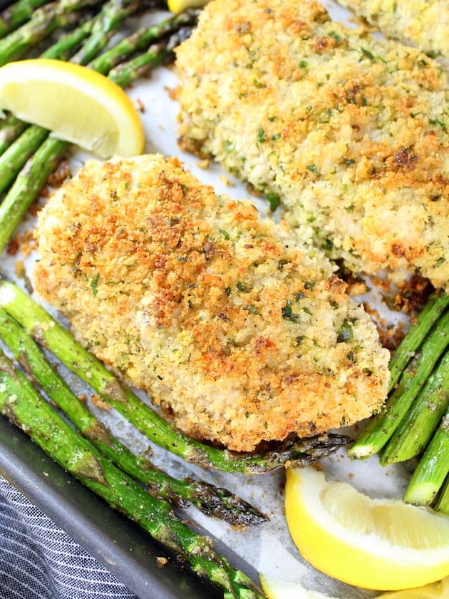 Close up breaded pork chop with asparagus