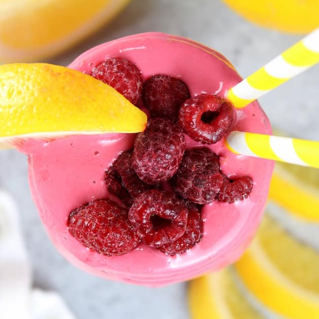 Over top pink raspberry smoothie in mason jar