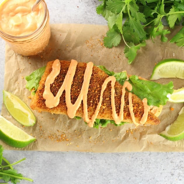 Piece of breaded cod with baja sauce