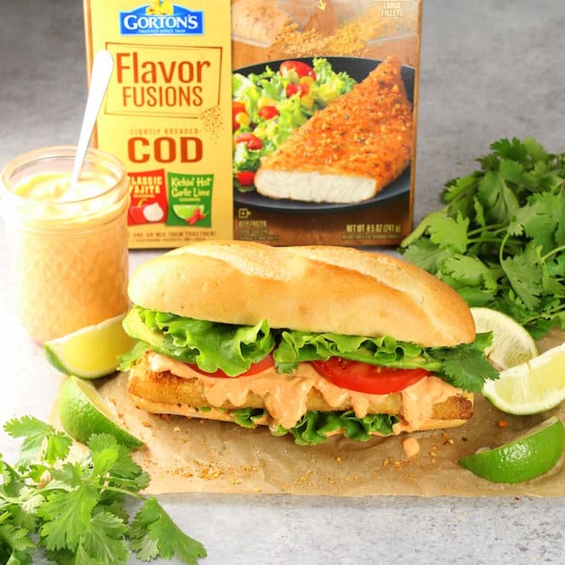 A breaded fish sandwich with meat and lettuce