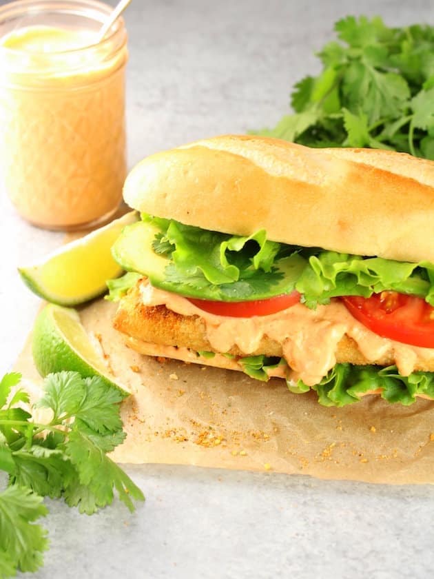 Baja Fish Cod Sandwich On bun with lettuce, tomato, and sauce