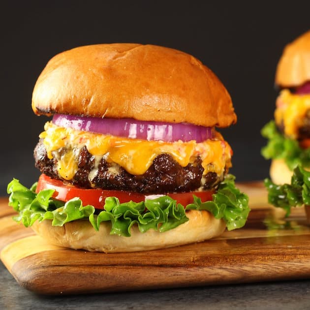 Pimento Cheese and Bacon Burger on a cutting board