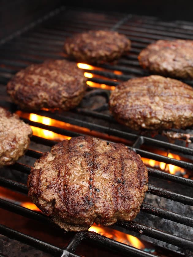 Burgers cooking on a grill