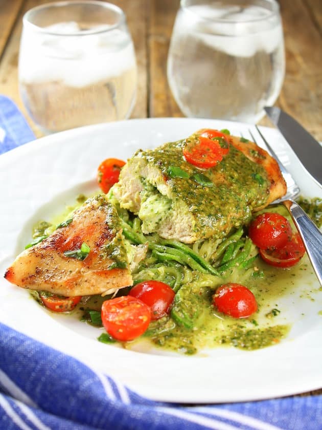 Stuffed chicken breast on bed of zucchini noodles