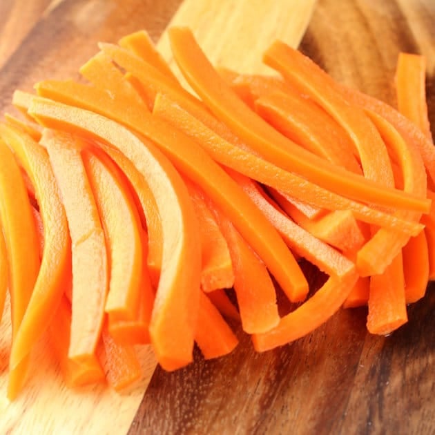 Sliced carrots on a cutting board