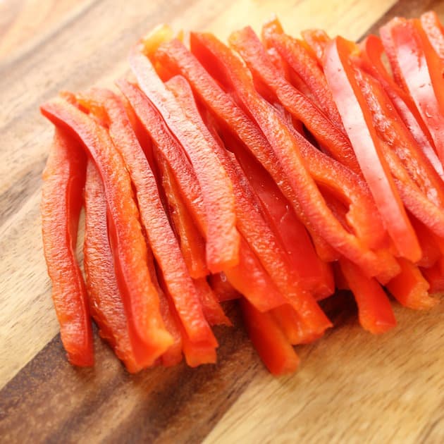 Sliced Red Peppers on a cutting board