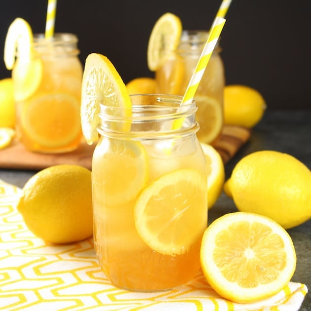 Mason jars with lemonade and fresh lemon garnishes