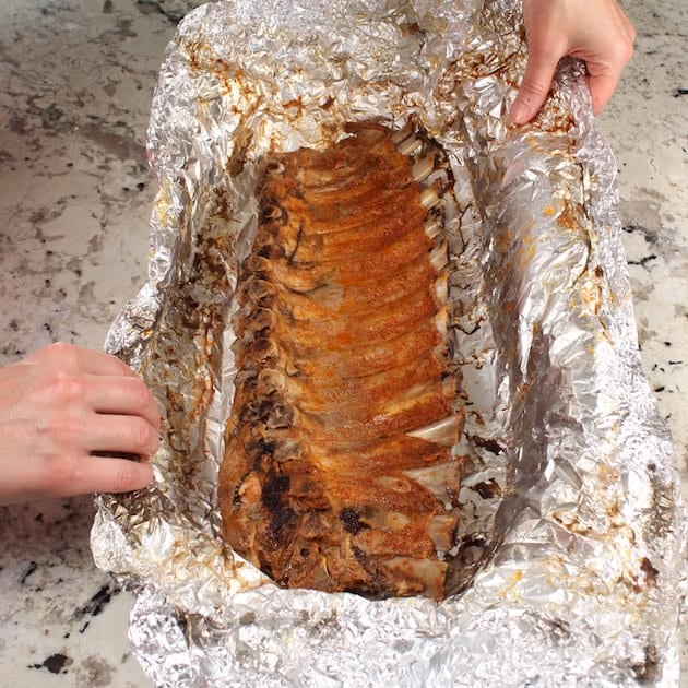 Opening the ribs in foil after cooking in the oven