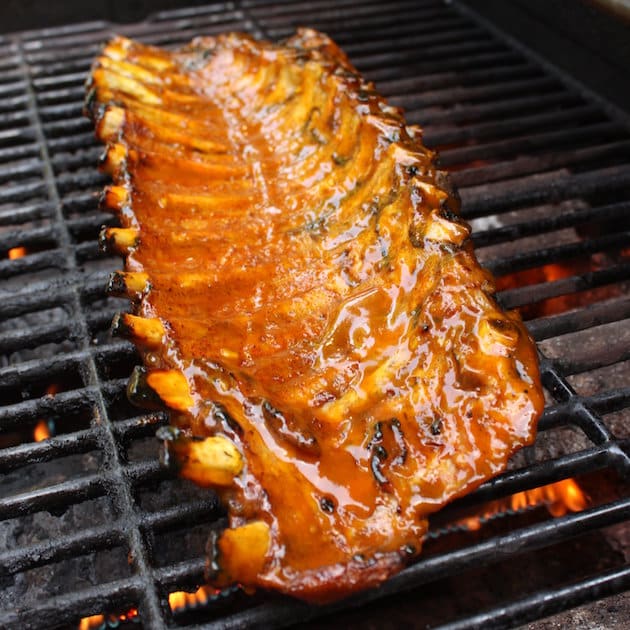 Rack of ribs cooking on the grill