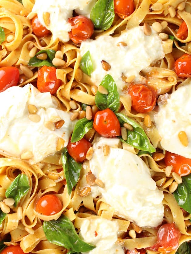 Close up of Tagliatelle with Burrata, Tomatoes, and Pine Nuts