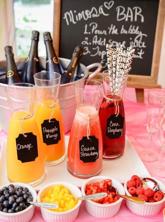 Carafes with fruit juice on a table