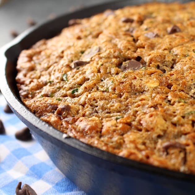 Eye Level Partial Chocolate chip zucchini cake in a cast iron skillet