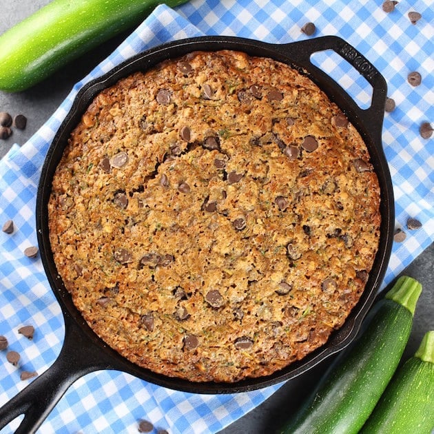 Chocolate Chip Zucchini Cake in a cast iron skillet over top