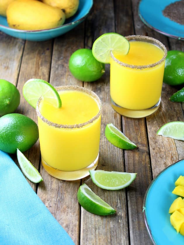 Smoky Mango Margarita with limes and mangos