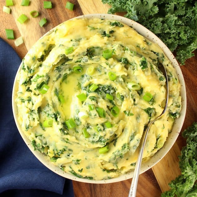 Cheesy Kale Mashed Potatoes on a cutting board