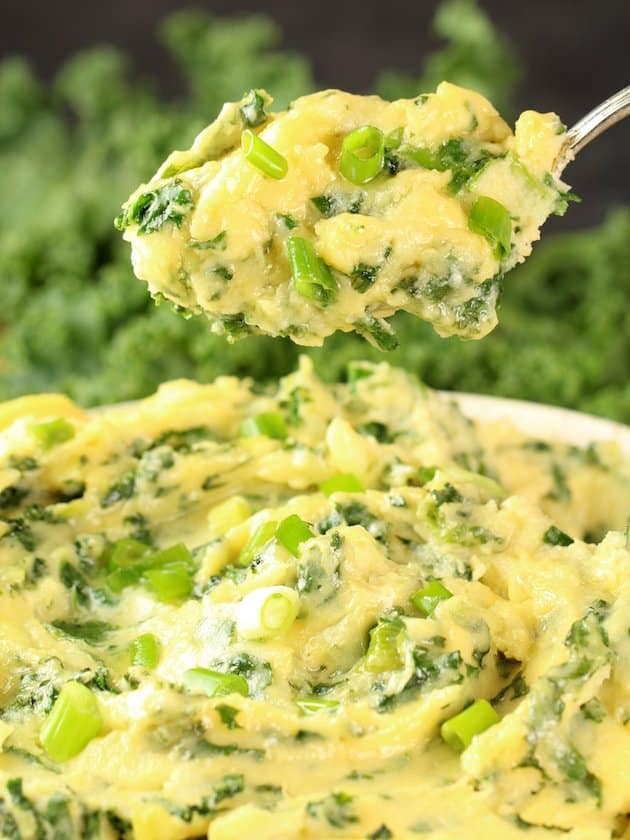 Closeup spoonful of cheesy kale mashed potatoes