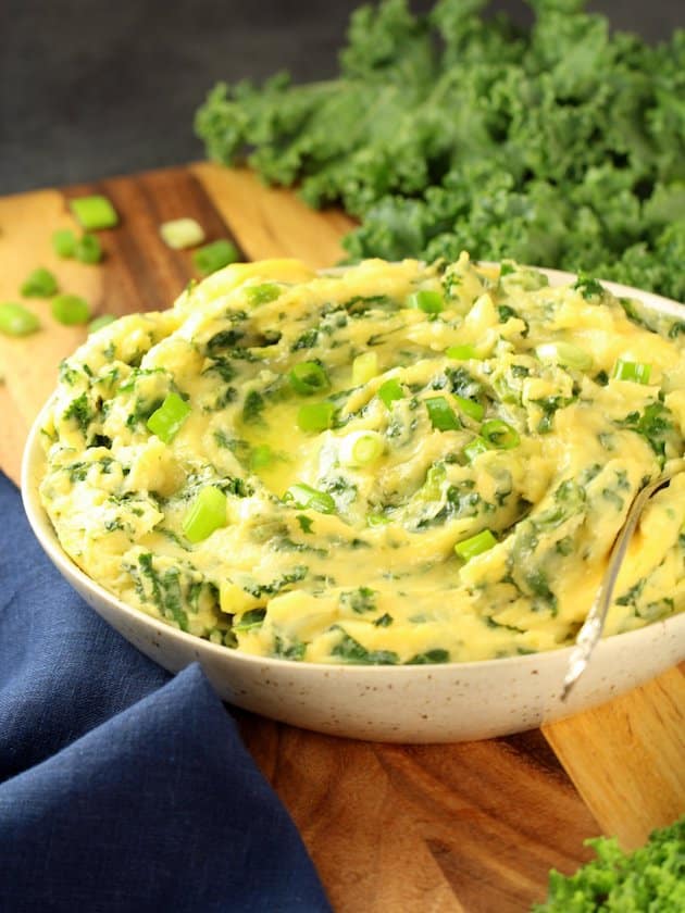 Spoon in bowl of Cheesy Kale Mashed Potatoes 