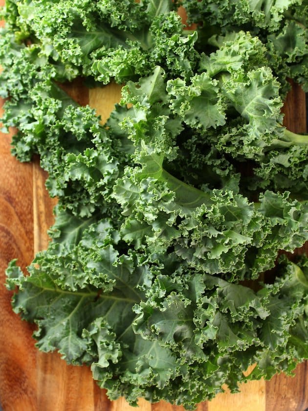 Fresh kale on cutting board