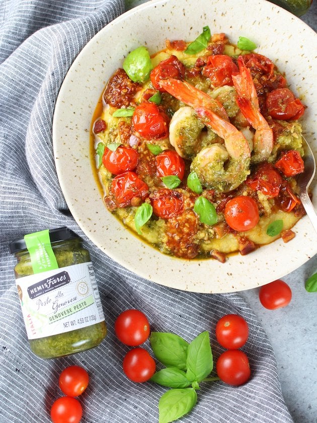 Pesto Shrimp With Parmesan Polenta next to jar of pesto sauce