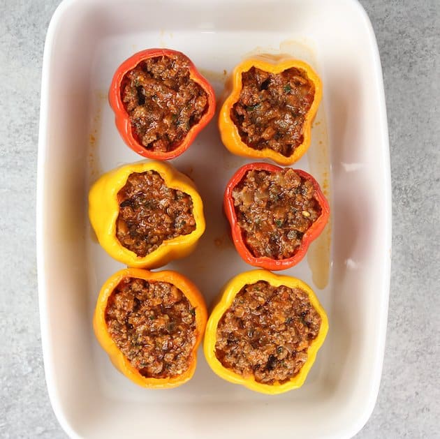 Adding Italian meat sauce mixture into lasagna stuffed peppers