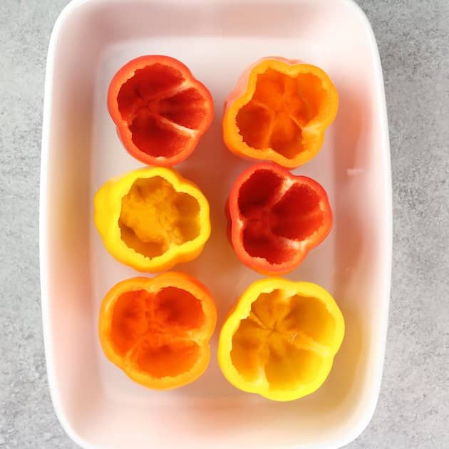 bell peppers in a cassrole dish ready to stuff