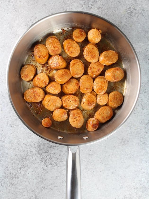 chicken sausage fried in a pan