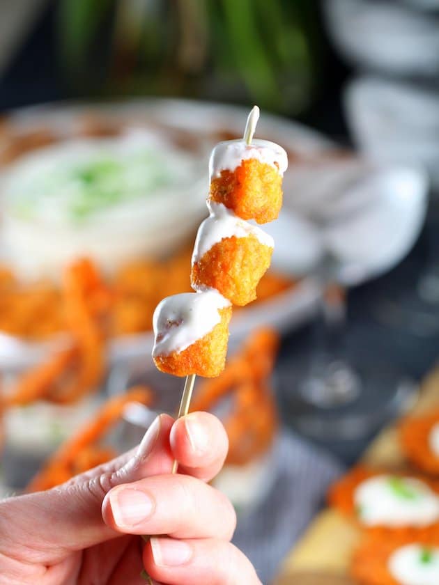 Three tater tots on a skewer