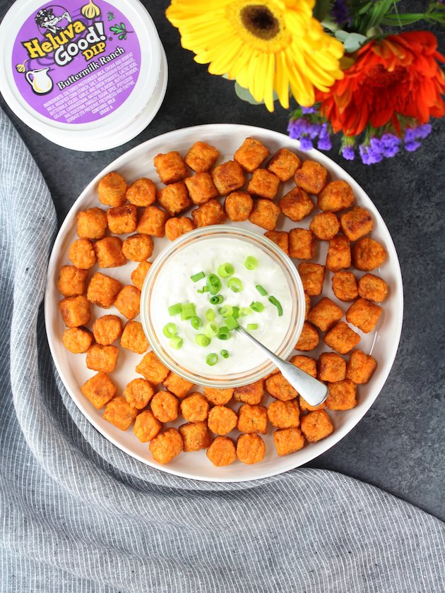 Platter with sweet potato tater tots and cheesy onion dip