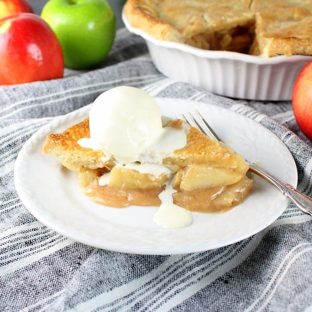 Vanilla ice cream melting on apple pie