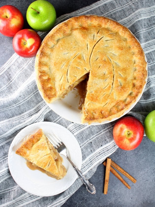 Caramel Apple Pie with slice cut out on a plate