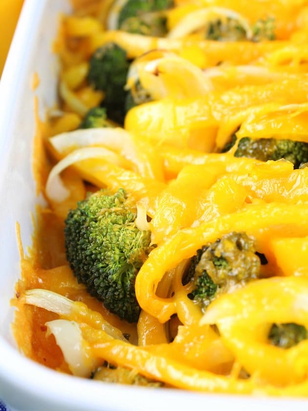 A close up of a plate of food with broccoli and pasta, with Chicken and Casserole