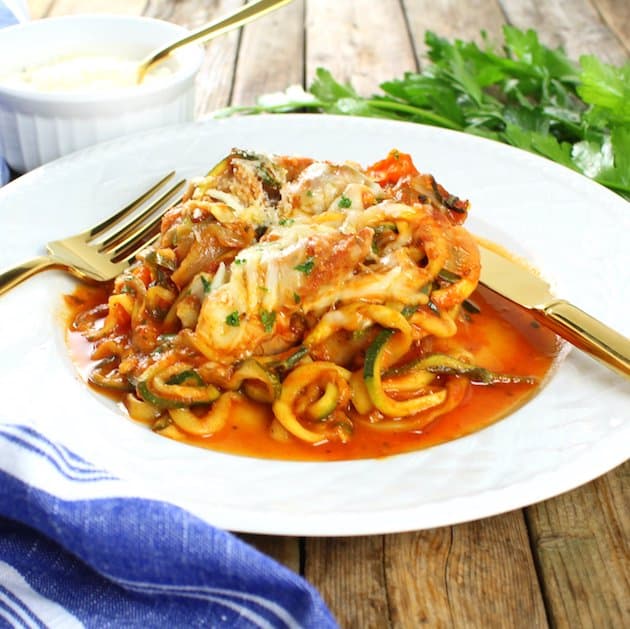 A plate of zucchini Noodles, Sausage, and peppers