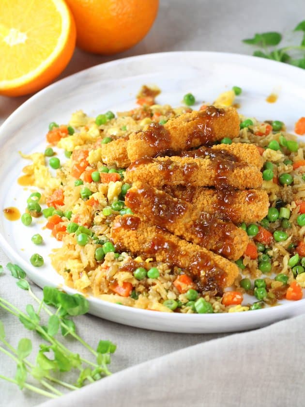 Platter with crispy fish on cauliflower fried rice