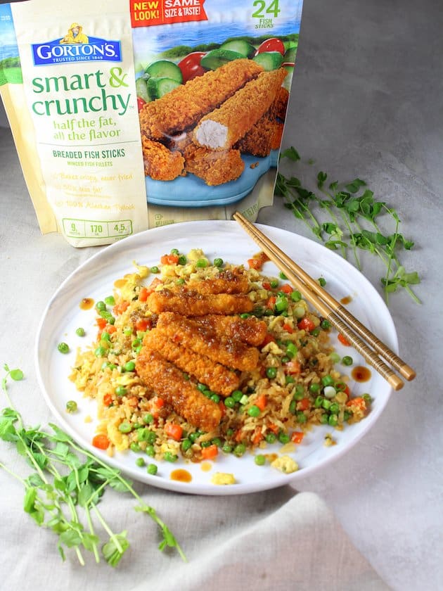 Soy-Orange Crispy Fish over Cauliflower Fried Rice  - Plated Dish with Gorton\'s Fish Packaging