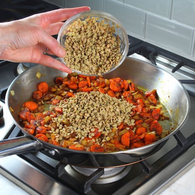 Adding lentils to pan stovetop