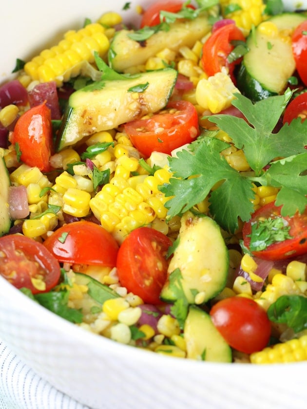 A plate of food, with Corn and Salad