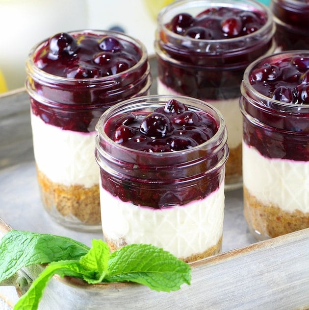 Mason jars with layered blueberry cheesecake