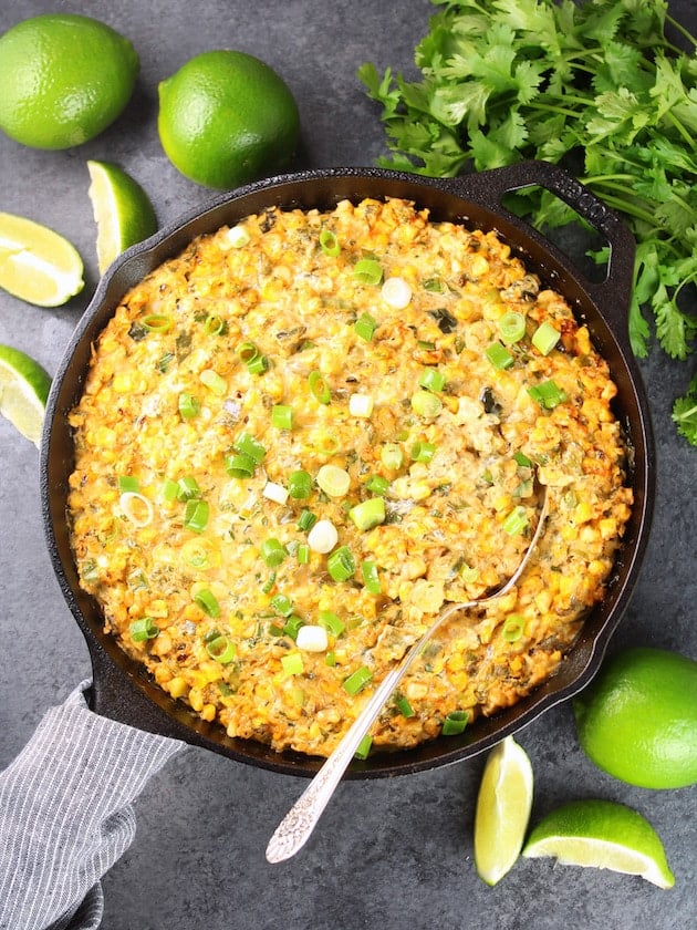 Smoky Poblano Corn Dip in the skillet with a spoon