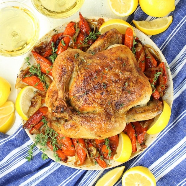 Whole Roasted Chicken on plate with veggies