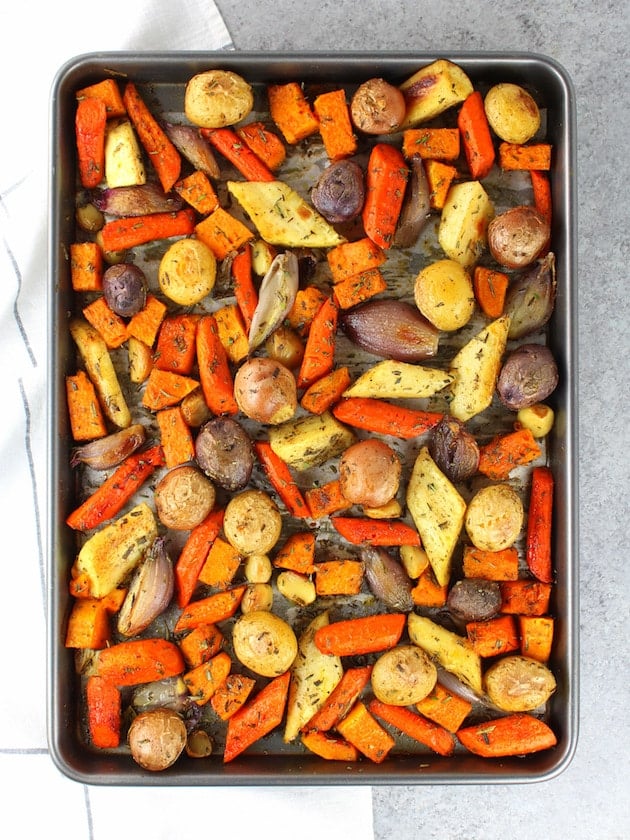 Vegetables on cookie sheet after they have been roasted in the oven.